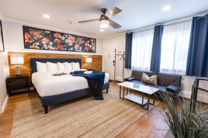a hotel room with a bed and a couch at Ocean View Terrace in Hampton Bays +279 photos