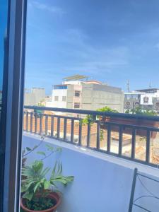 a balcony with a view of a building at Quarto Nº5 FANTASTIQUE- Central Praia in Praia