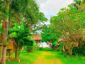 Ein Garten an der Unterkunft Margarita Beach
