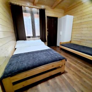 Łóżko lub łóżka w pokoju w obiekcie Ośrodek 9Amber