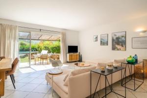 a living room with a couch and a table at Just in Cap Canaille in Cassis