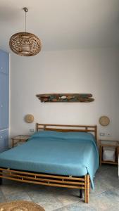 A bed or beds in a room at Sunrise B&B Le castella