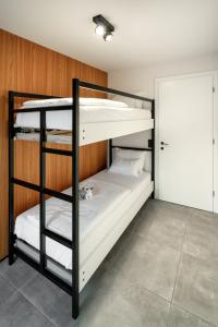 Ένα ή περισσότερα κρεβάτια σε δωμάτιο στο B-Lodge Kärnten