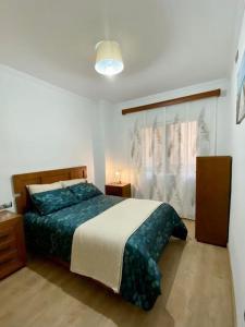 Posteľ alebo postele v izbe v ubytovaní Piso acogedor en Málaga