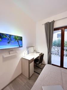 Televízia a/alebo spoločenská miestnosť v ubytovaní Apartments T&T + 32 fotografií
