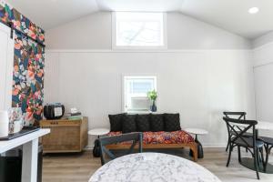 a living room with a couch and a table at Ocean View Terrace in Hampton Bays