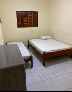 En eller flere senge i et værelse på Apto Temporada