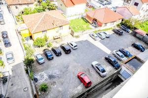 an aerial view of a parking lot with cars at Happy stories' apartment in city centre in Shkodër