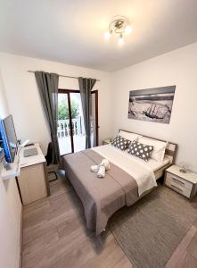 Posteľ alebo postele v izbe v ubytovaní Apartments T&T