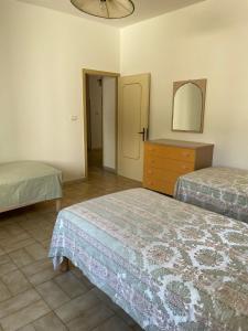 Krevet ili kreveti u jedinici u objektu villa TiCia a 100 metri dalla spiaggia con parcheggio privato