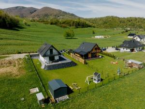 an aerial view of a house in a field at Domek pod Nowiną in Tylmanowa