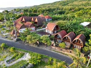 an aerial view of a village with houses and a road at Boga Segara Villa And Resto in Nusa Penida