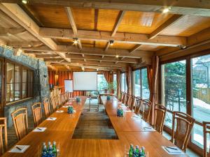 a large conference room with a long table and chairs at Hotel Nosalowy Dwór in Zakopane