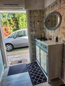 a kitchen with a car parked in a garage at Stuga Ani Wellness & Sauna in Svartå +86 photos