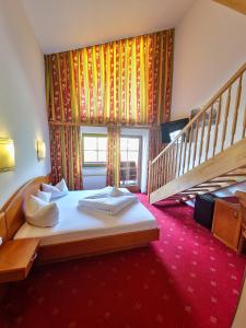 Das Alpin - Hotel Garni Guesthouse 객실 침대