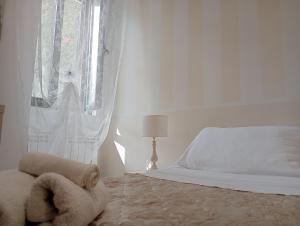 Postel nebo postele na pokoji v ubytování Vigne Vecchie