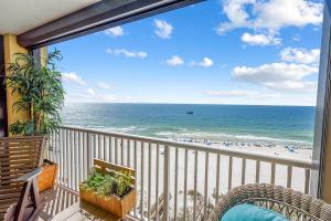 a balcony with a view of the beach at Summer House 901A by ALBVR - Gorgeous Beachfront Corner Condo with Incredible Views in Orange Beach