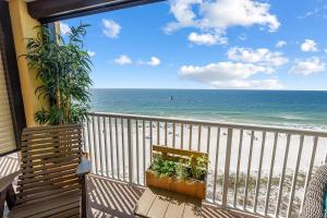 a balcony with a view of the beach and the ocean at Summer House 901A by ALBVR - Gorgeous Beachfront Corner Condo with Incredible Views in Orange Beach