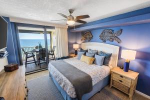 a bedroom with a bed with a view of the ocean at Summer House 901A by ALBVR - Gorgeous Beachfront Corner Condo with Incredible Views in Orange Beach
