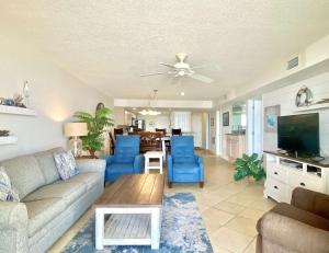 a living room with a couch and a table at Wind Drift 102S by ALBVR - 2BR, 2BA Beautiful Upgraded Beachfront Condo near Flora Bama, Outdoor Pools and Tennis Courts in Orange Beach