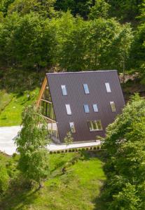 an overhead view of a house in the woods at Vidis Chalet Hotel in Theth