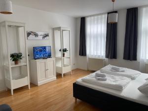 Giường trong phòng chung tại Peaceful Apartment for 4