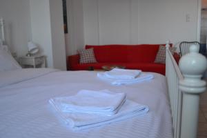 A bed or beds in a room at Aegean View House