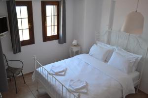 A bed or beds in a room at Aegean View House