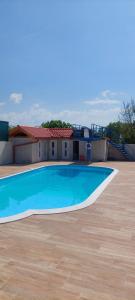 a large swimming pool on top of a house at Gästehaus Kathi Campingplatz Buschcamper in Gyenesdiás