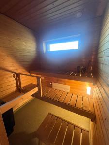 an inside view of a sauna with a window at Annalan Helmi - Viihtyisä koti hyvillä kulkuyhteyksillä ja saunalla in Tampere