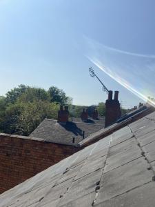 a sprinkler on top of a roof with roofs at Willow House in Birmingham