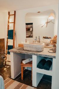 a bathroom with a sink and a mirror at Rustico con SPA Privata - Piscina - Sauna - Hammam - Free Wi-Fi & NETFLIX in Brossasco