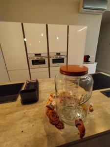 a jar with shrimp inside of it on a kitchen counter at Home Sweet Home Mercaderes in Pamplona