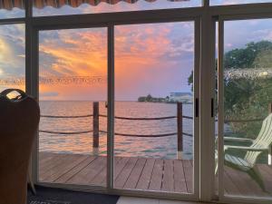 a view of the ocean from a room with a window at Seaward Sea view double room with balcony in Koror