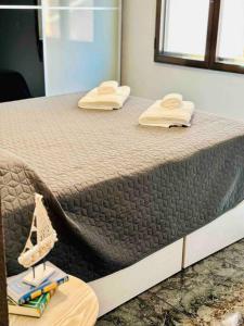 Łóżko lub łóżka w pokoju w obiekcie Playa Bonita Apartment