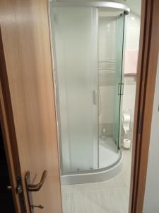 a glass shower in a bathroom with at Studio appMZ in Krk