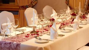 a table with wine glasses and napkins on it at Hotel Kloster Hirsau in Calw +20 photos
