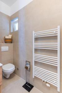 a bathroom with a toilet and a sink at Apartments Ivanka Cres in Cres +44 photos