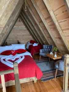 a bedroom with two beds in a attic at Orca Bungalows in Ardeşen