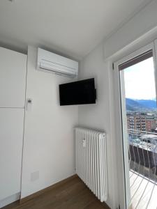 Televízia a/alebo spoločenská miestnosť v ubytovaní Settimo Cielo Apartment Aosta CIR 0199 + 29 fotografií