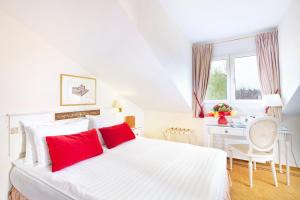 Postel nebo postele na pokoji v ubytování Hotel des Horlogers