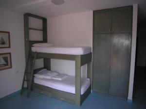 a bunk room with a bunk bed and a ladder at Residence Le Terrazze in Olbia