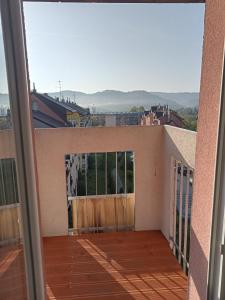 a view from the balcony of a house with a wooden gate at Way2Jaworzyna in Krynica Zdrój
