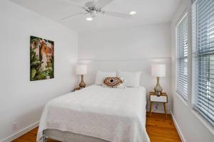 A bed or beds in a room at Classy 4BDRM Home W/Pool Mins To Beach and Shops!