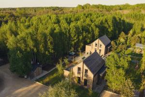 an overhead view of a house in the woods at Między Brzozami / Domy w lesie in Ciekocino