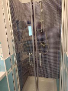 a shower with a glass door in a bathroom at B&B Casa Tropea in Tropea