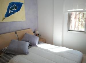 Posteľ alebo postele v izbe v ubytovaní Apartament amb jardí privat i piscina