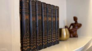 a row of books sitting on a shelf at Chapter Cottage, Cheddleton Nr Alton Towers, Peak District, Foxtail Barns, the Ashes in Cheddleton