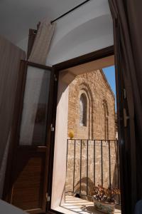 an open window with a view of a church at Giulietta Normanna in Sciacca