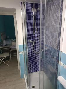 a bathroom with a shower with a glass door at B&B Casa Tropea in Tropea